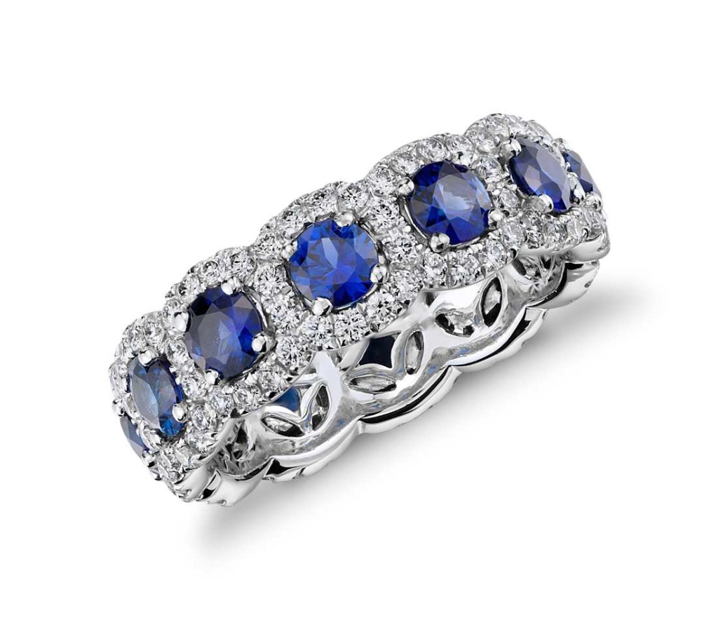 Sapphire and Diamond Halo Eternity Ring in 18k White Gold Exquisite, velvety blue sapphires are encircled by brilliant pavé-set diamond halos in this eye-catching 18k white gold eternity-style ring.