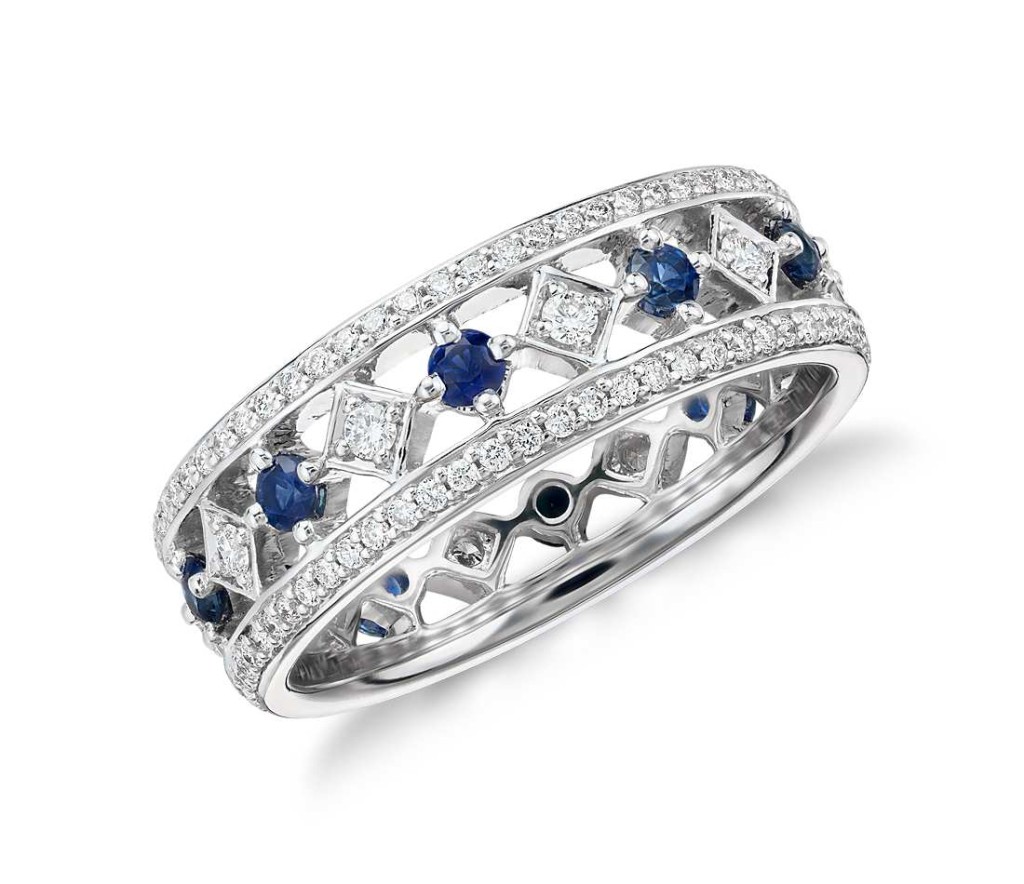 Gala Sapphire and Diamond Eternity Ring in 18k White Gold Delicate in design, this eye-catching 18k white gold eternity ring features alternating rich blue sapphires set between a brilliant pavé diamond channels