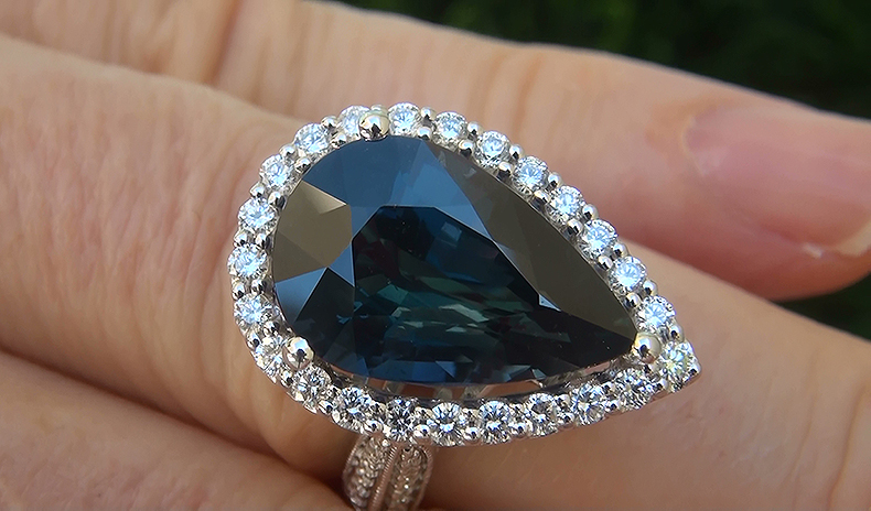 There are also 74 round brilliant natural untreated accent diamonds totaling an additional 0.88 carats set with the Sapphire in a classic style. These "Perfectly Clear" diamonds are graded at Near Flawless "VS1-VS2" Clarity with COLORLESS & NEAR COLORLESS "F-G" Color s