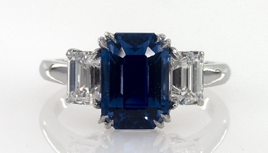 PLATINUM EMERALD SHAPED SAPPHIRE AND DIAMOND THREE STONE RING
