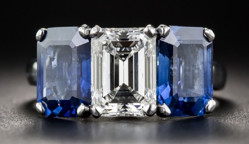 A Gorgeous 1.73 Carat Emerald-Cut Diamond and No Heat Sapphire Three-Stone Ring